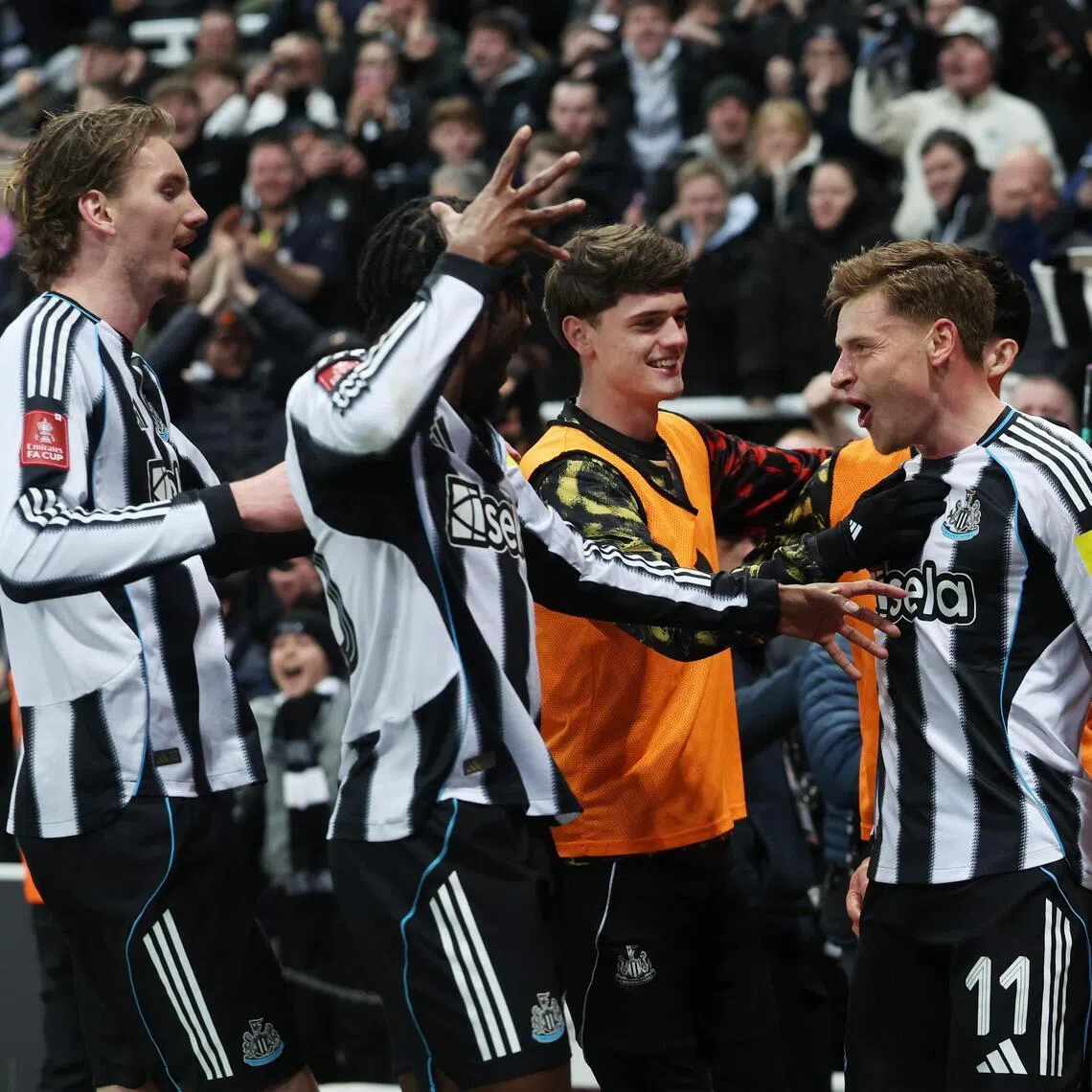 Newcastle United's Harvey Barnes celebrates scoring their first goal with his teammates in the 3-1 FA Cup fifth round loss to Manchester City at St James' Park on March 7, 2026.