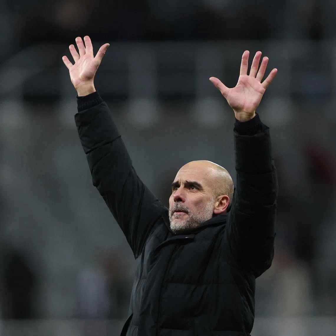 Soccer Football - Carabao Cup - Semi Final - First Leg - Newcastle United v Manchester City - St James' Park, Newcastle, Britain - January 13, 2026 Manchester City manager Pep Guardiola celebrates after the match REUTERS/Scott Heppell