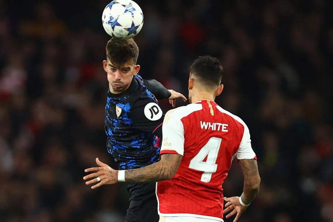 FILE PHOTO: Soccer Football - Champions League - Group B - Arsenal v Sevilla - Emirates Stadium, London, Britain - November 8, 2023 Sevilla's Enrique Salas in action with Arsenal's Ben White REUTERS/Hannah Mckay