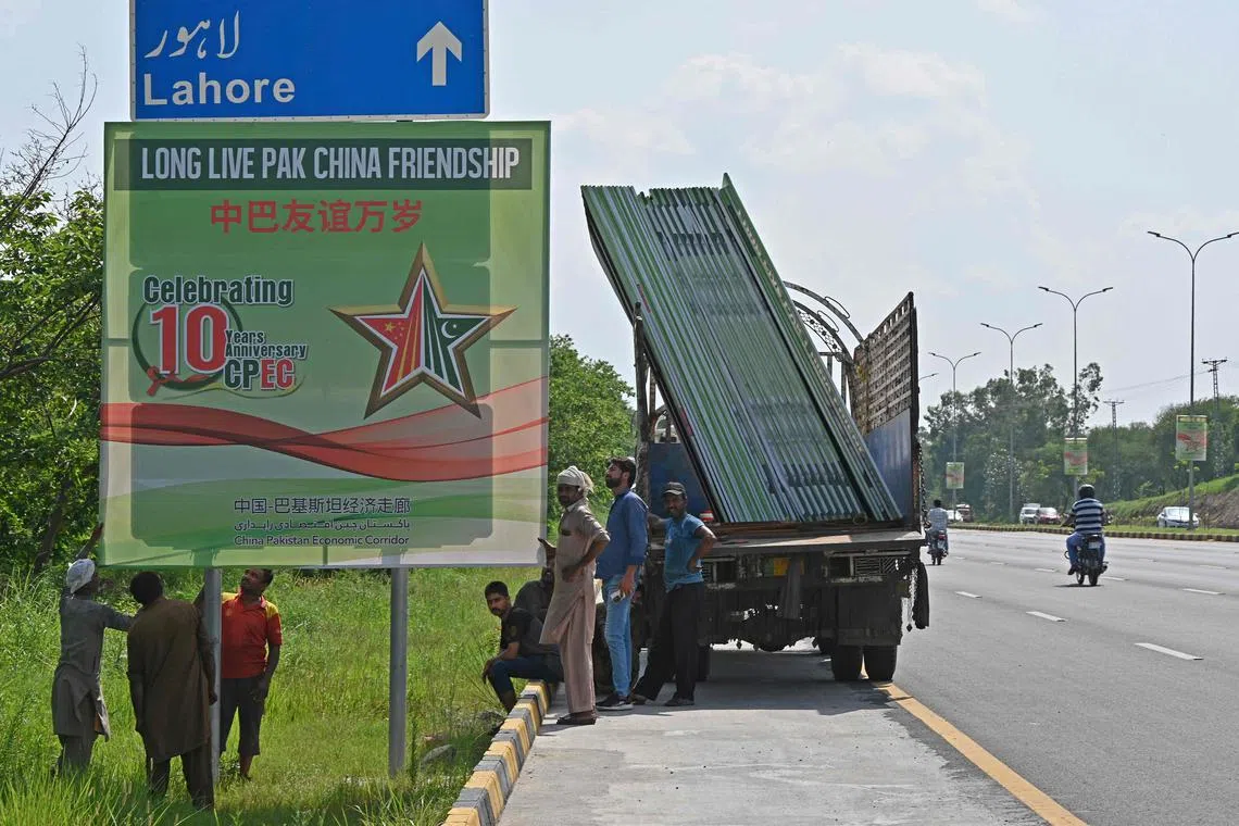 Billboards being installed in Islamabad in July ahead of a visit by Chinese Vice-Premier He Lifeng to mark the 10th anniversary of a mega economic plan that is the cornerstone of Beijing's Belt and Road Initiative.