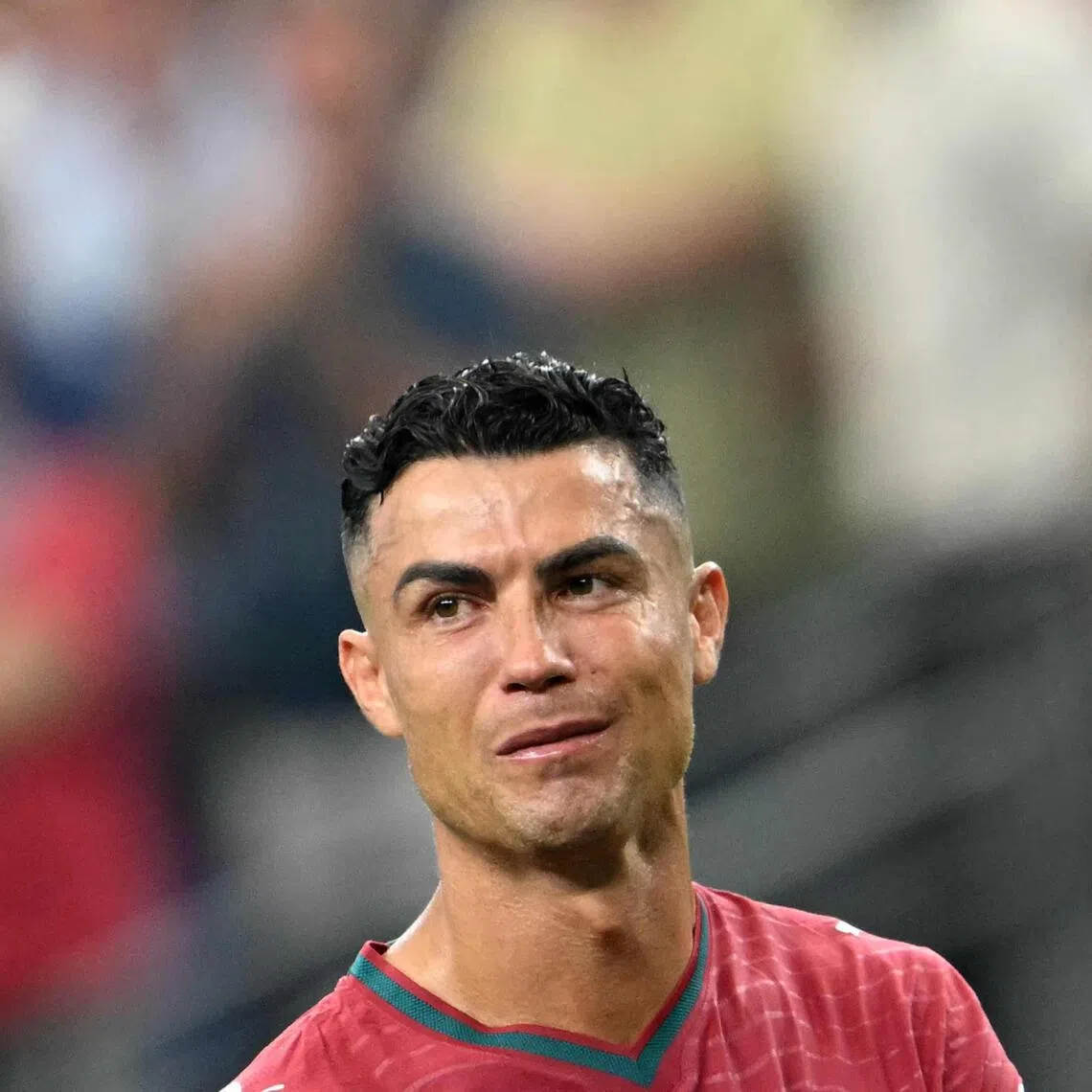 TOPSHOT - Portugal's forward #07 Cristiano Ronaldo reacts after losing the 2026 World Cup round of 16 football match between Portugal and Spain at the Dallas Stadium in Arlington on July 6, 2026. (Photo by RONALDO SCHEMIDT / AFP)
