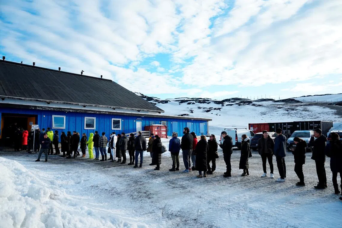 People queue to vote for the parliamentary elections for the Inatsisartut in Godthaabshallen, on the day of the general election, in Nuuk, Greenland, March 11, 2025. Ritzau Scanpix/Mads Claus Rasmussen via REUTERS
