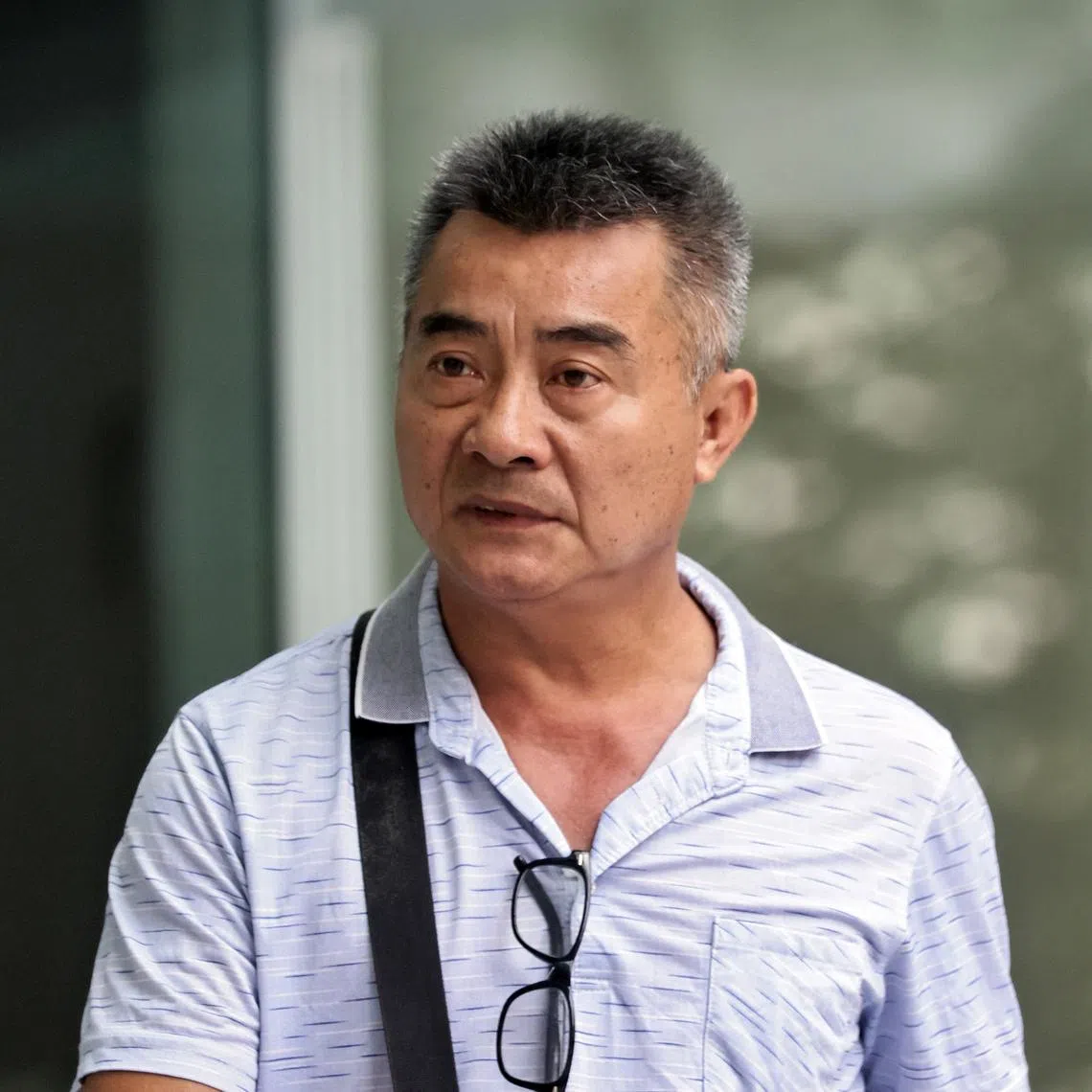 The 56-year-old pleaded guilty to two charges for causing the heavy vehicle to collide with government properties and driving a vehicle taller than 4.5m without being escorted by either a police officer or an auxiliary police officer.