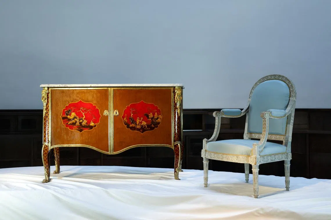 A Royal Late Louis XV Ormolu-Mounted Painted-Tole Commode Cira 1790, and a Royal Louis XVI Armchair, Cira 1788.