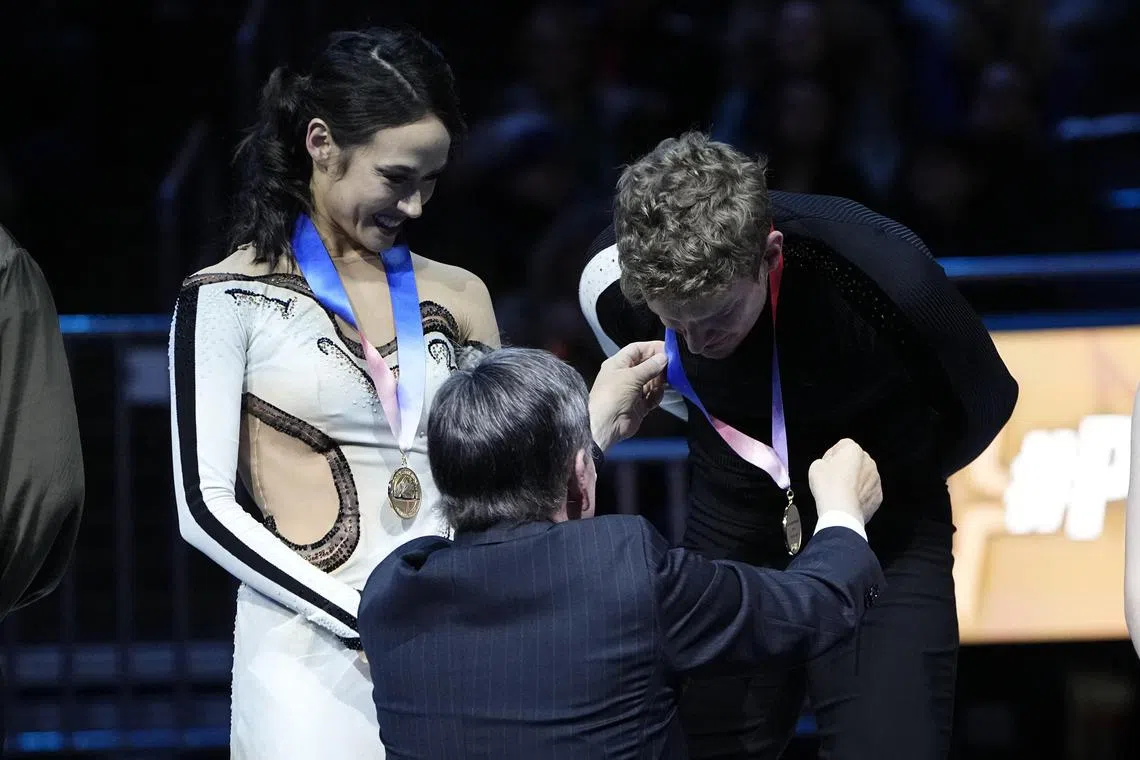 Madison Chock and Evan Bates receiving their medals after the championship free dance at the 2024 US Figure Skating Championships.