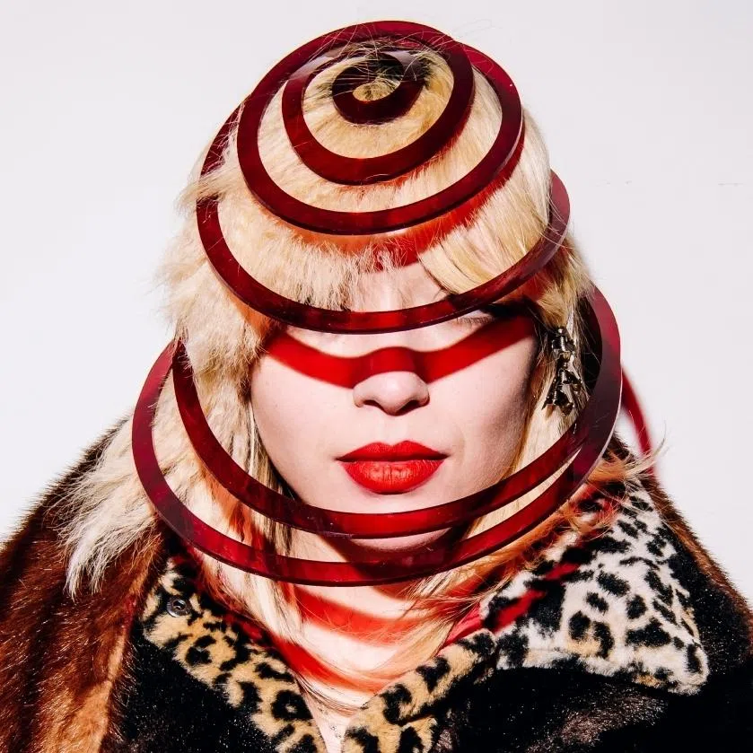 Cyndi Lauper fans Kelli Bailey (left) with a jacket and Riley Verri with a handmade plastic chapeau that they purchased at the singer’s “closet cleanout” in New York.