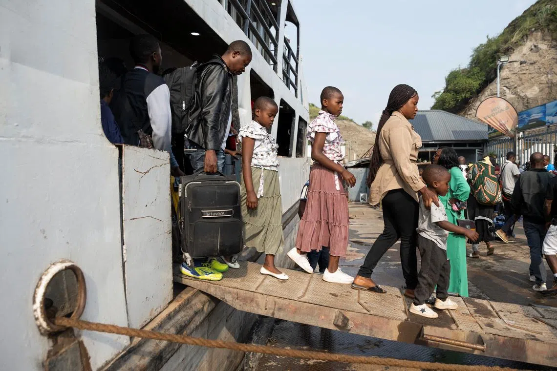 Passengers arriving from Bukavu disembark from the Emmanuel boat, on its first trip between Bukavu and Goma since the city was taken by M23 rebels, in Goma, North Kivu province, Democratic Republic of Congo February 18, 2025. REUTERS/Arlette Bashizi
