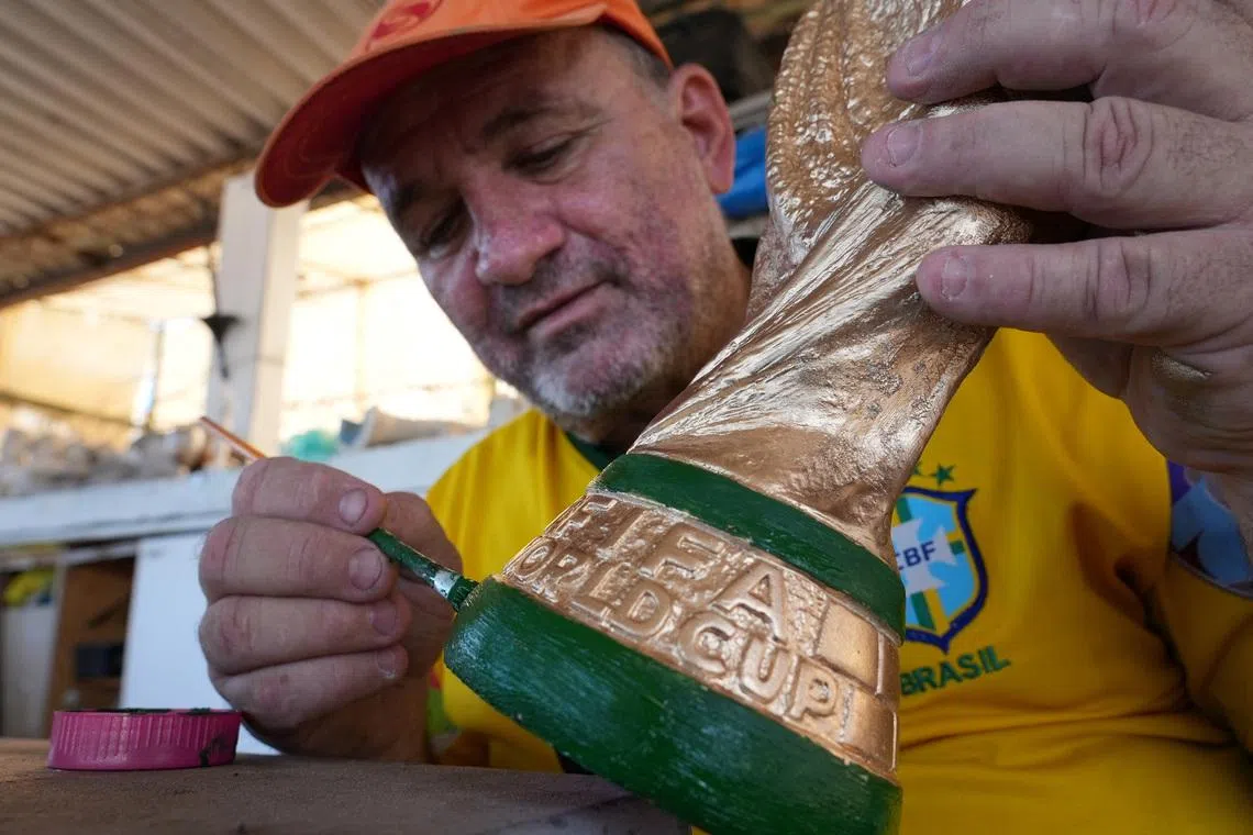 In Rio, artisan crafts World Cup trophies while hoping Brazil get a real one