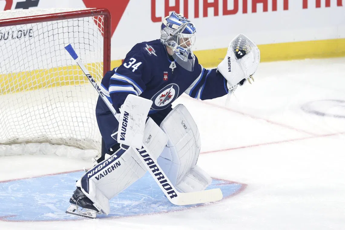 FILE PHOTO: Sep 21, 2024; Winnipeg, Manitoba, CAN;  Winnipeg Jets goaltender Kaapo Kahkonen (34) warms up before a preseason game against the Minnesota Wild at Canada Life Centre. Mandatory Credit: James Carey Lauder-Imagn Images/File Photo