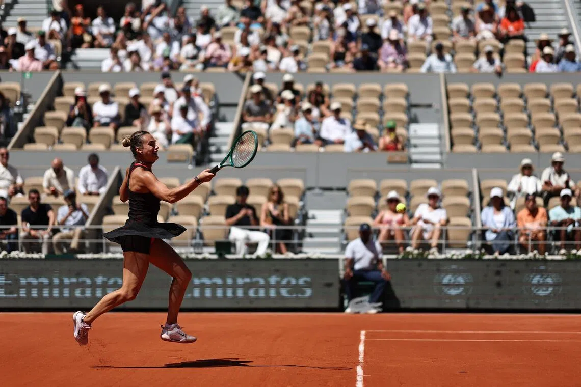 Belarus' Aryna Sabalenka plays a forehand return to Spain's Jessica Bouzas Maneiro during their French Open match.