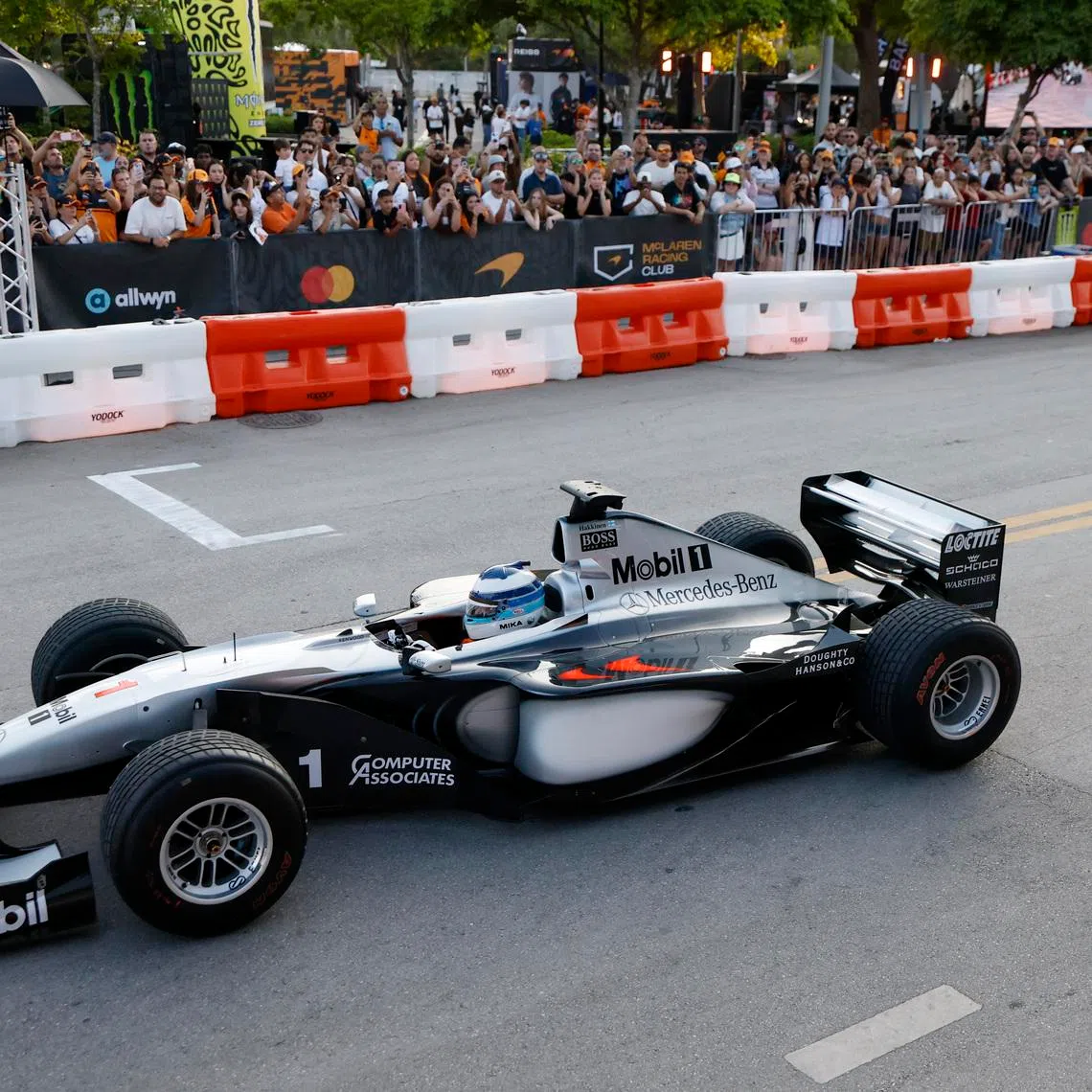 The MP4/14 is driven by Mika Hakkinen during the celebratory event by McLaren at the Miami Grand Prix on April 29.