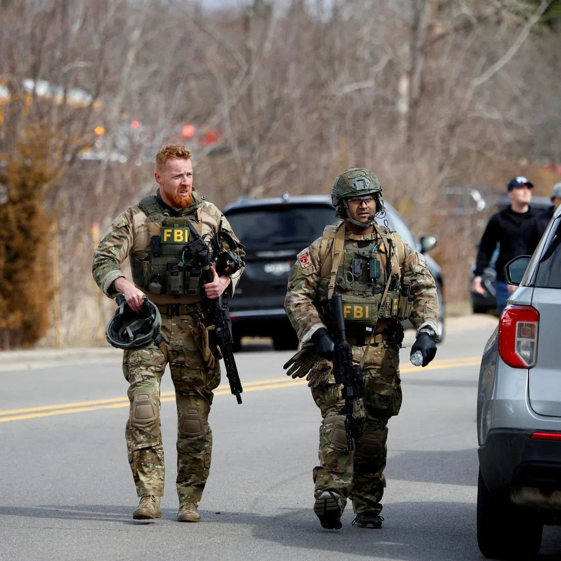 FILE PHOTO: FBI members work on the site after the Michigan State Police reported an active shooting incident at the Temple Israel Synagogue in West Bloomfield, Michigan, U.S., March 12, 2026. REUTERS/Rebecca Cook/File Photo