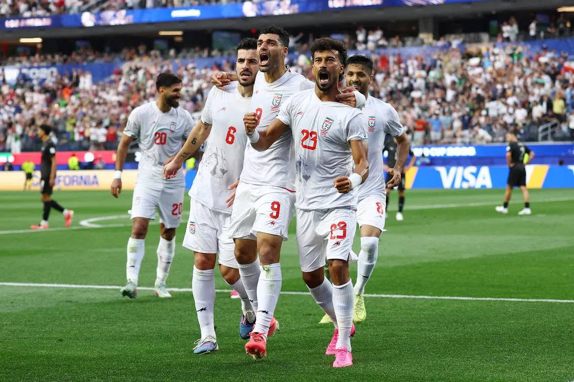Soccer Football - FIFA World Cup 2026 - Group G - Iran v New Zealand - Los Angeles Stadium, Inglewood, California, U.S. - June 15, 2026 Iran's Ramin Rezaeian celebrates scoring their first goal with teammates REUTERS/Matthew Childs