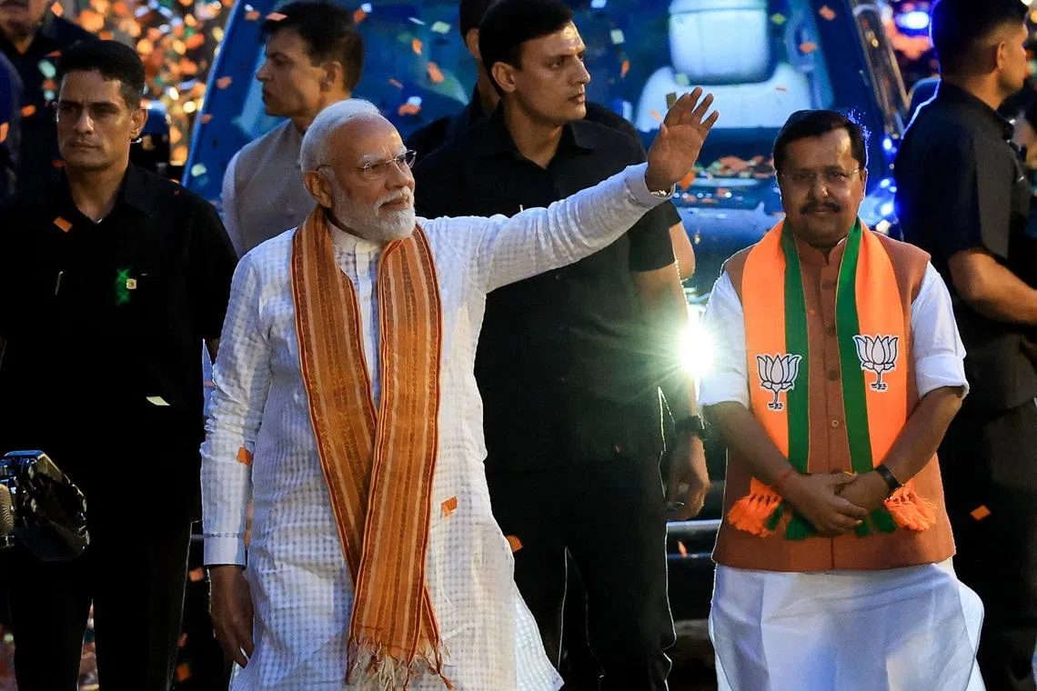 India's Prime Minister Narendra Modi greets his supporters as he arrives at the Bharatiya Janata Party (BJP) headquarters in New Delhi, India, May 4, 2026. REUTERS/Adnan Abidi/File Photo