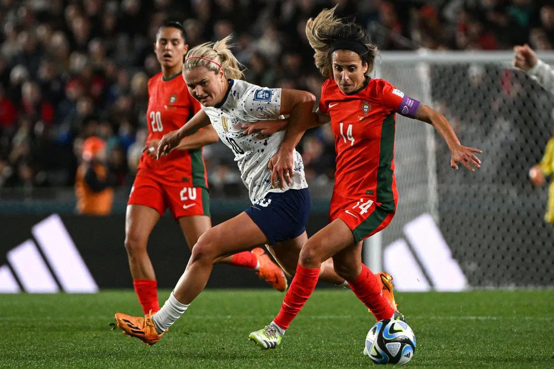 USA midfielder Lindsey Horan fights for the ball in their match against Portugal at the Women's World Cup.