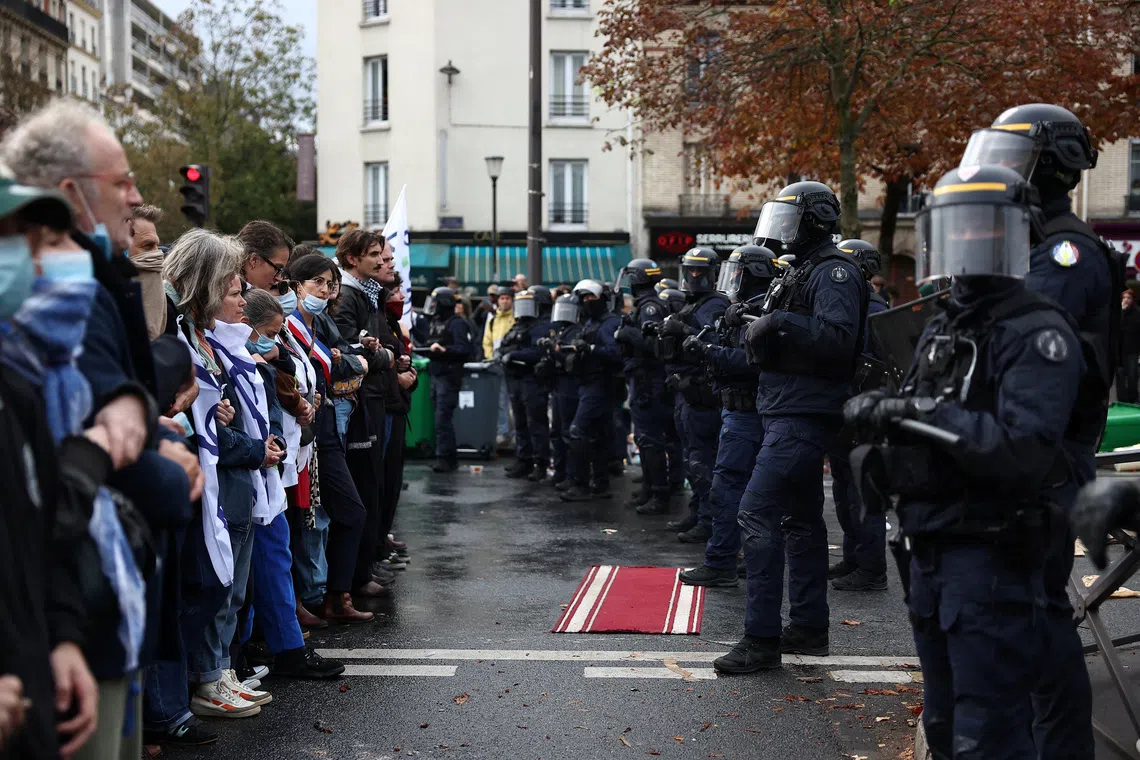 Students clustered outside the doors of several schools in Paris and other cities in the morning hours, brandishing placards and megaphones and chanting slogans.