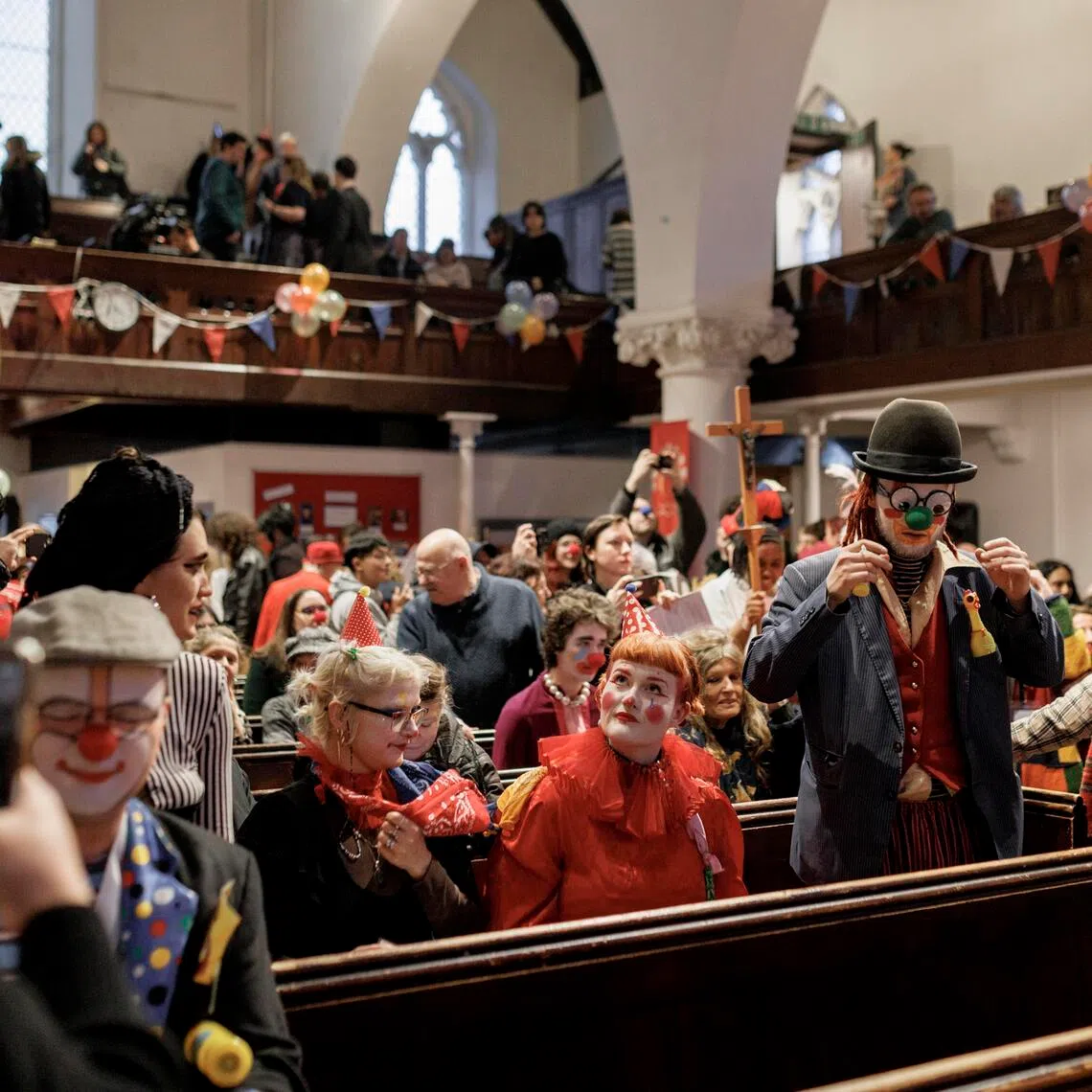 Clowns at a service honouring Joseph Grimaldi at All Saints Church in London on Feb. 1. Clowns wore their Sunday best to the service in its early years, but switched to their clown outfits in the 1960s.