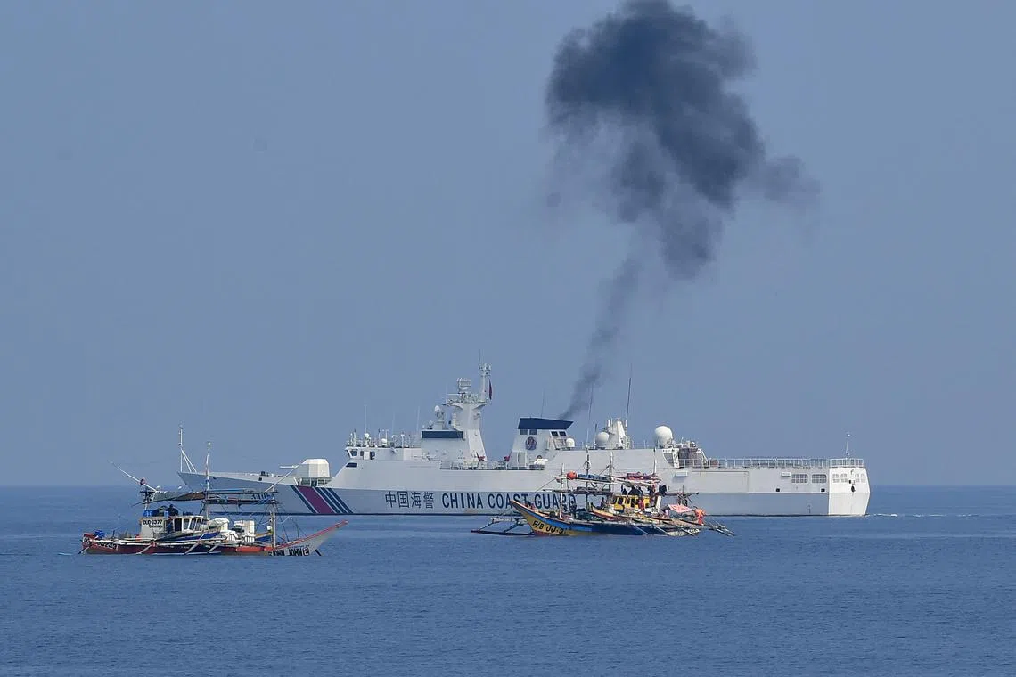 A Chinese coast guard ship shadowing Philippine fishing boats anchored near the Scarborough Shoal in the South China Sea on Sept 20.