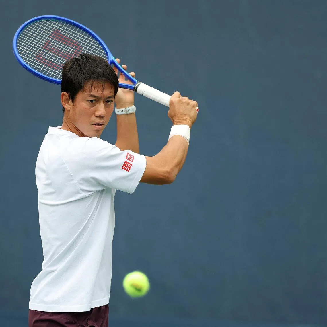 Kei Nishikori of Japan hits the ball during a practice session at the US Open.