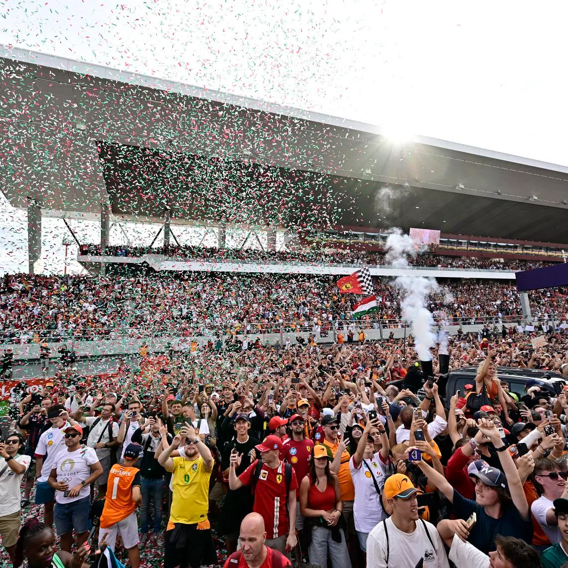 Formula One F1 - Hungarian Grand Prix - Hungaroring, Budapest, Hungary - August 3, 2025 Spectators on the track after McLaren's Lando Norris won the Hungarian Grand Prix REUTERS/Marton Monus