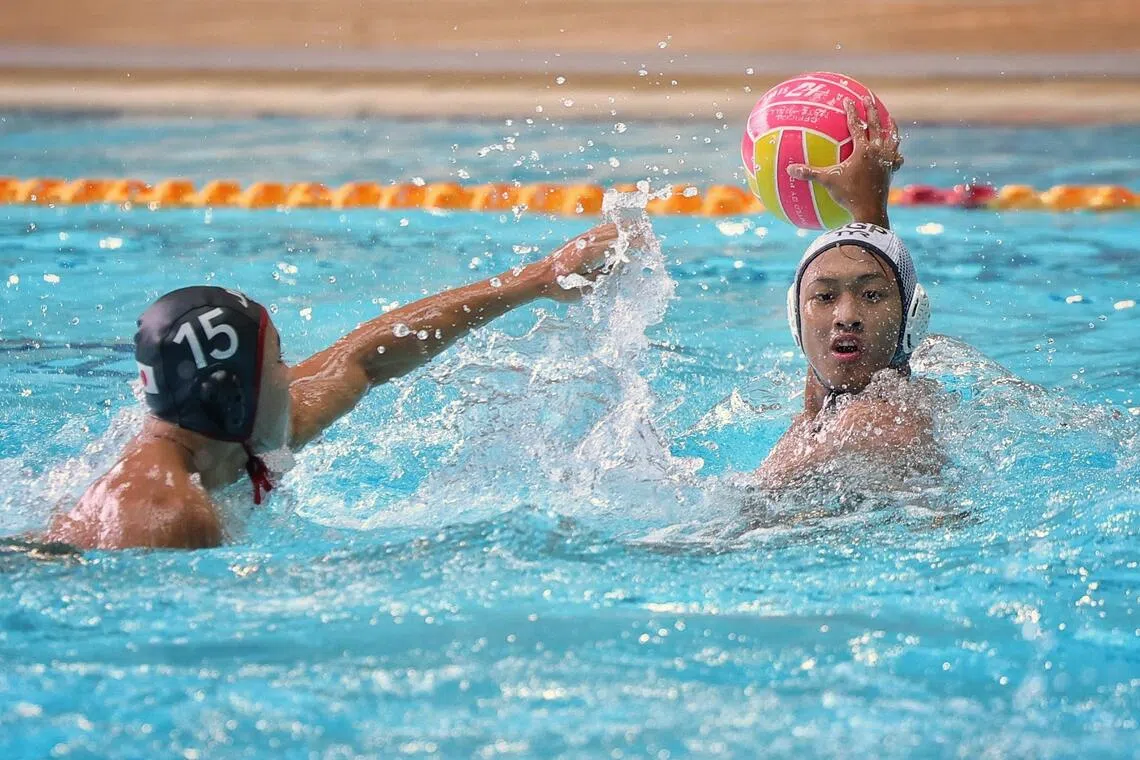 Justin Saik (right) of the national men’s water polo team in action during a closed door session at Singapore Sports School on July 7, 2025, ahead of the World Aquatics Championships.