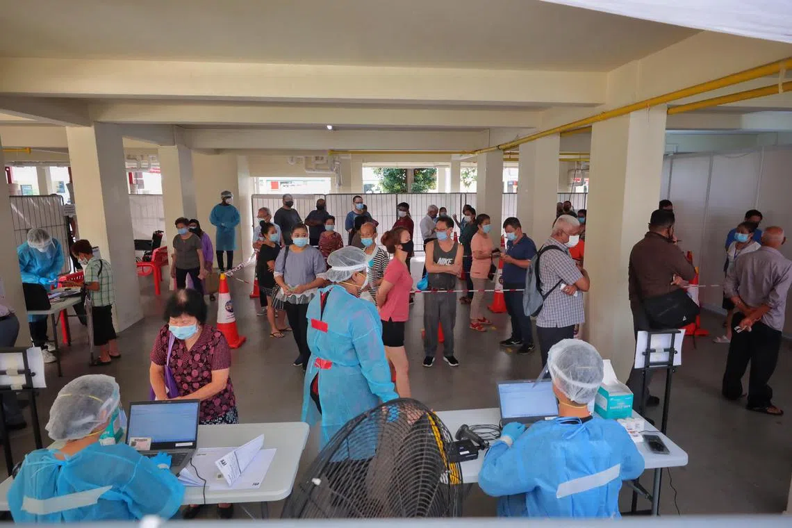 Residents queuing to take Covid-19 swab tests at Redhill Close, after viral fragments were detected in wastewater, on June 22, 2021. 