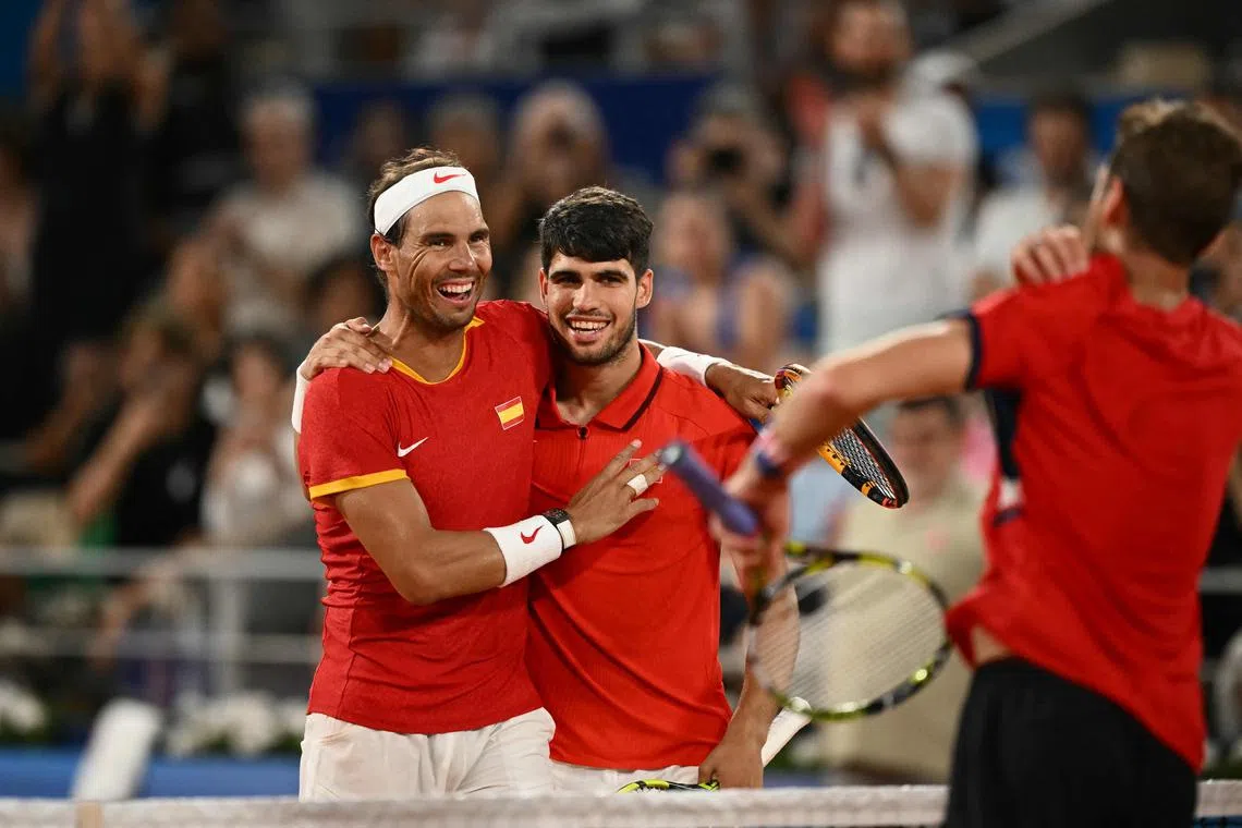 Spain's Rafael Nadal (left) embraces Carlos Alcaraz after they lose to the US' Austin Krajicek and Rajeev Ram.