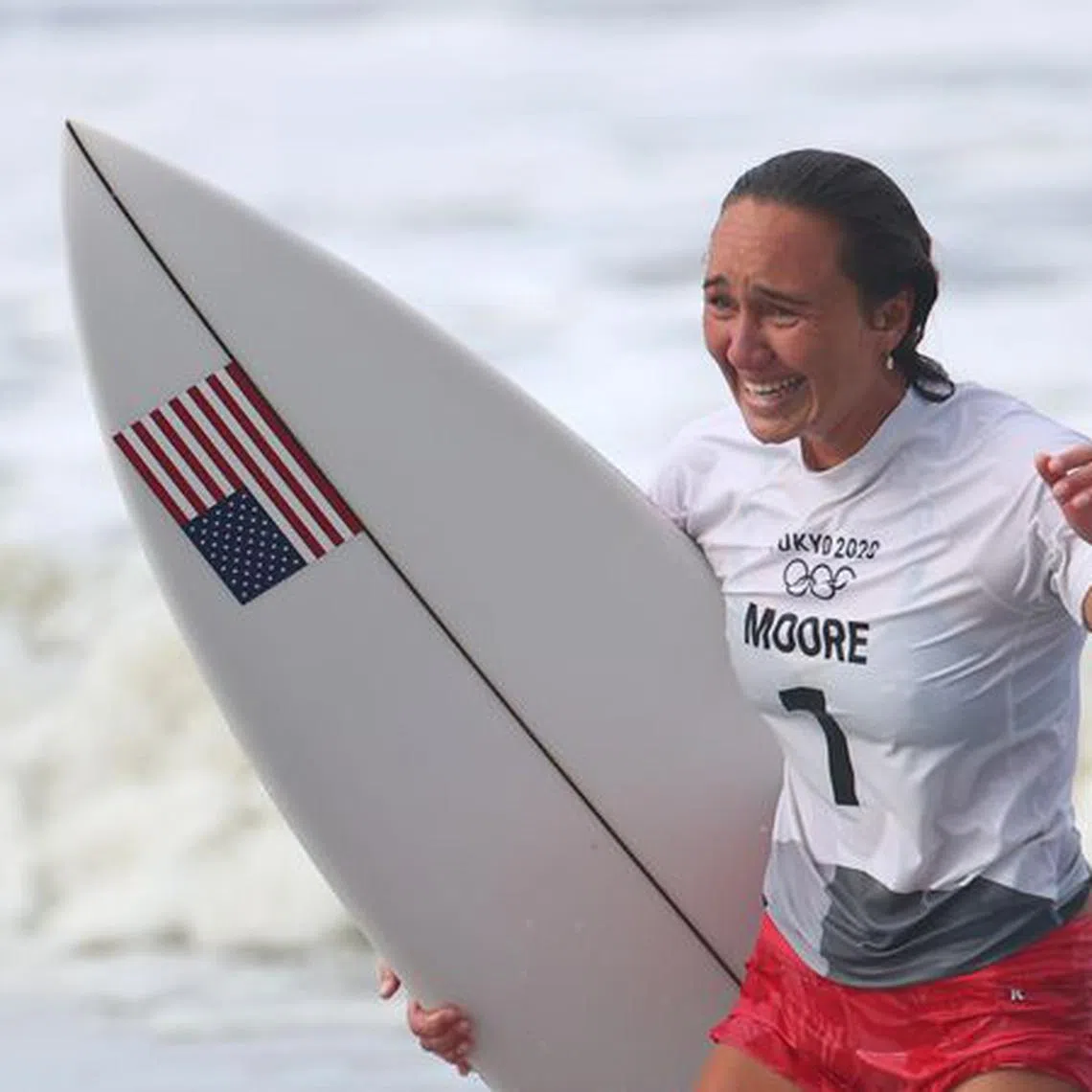 Tokyo 2020 Olympics - Surfing - Women's Shortboard - Gold Medal Match - Tsurigasaki Surfing Beach, Chiba, Japan - July 27, 2021. Carissa Moore of the United States celebrates after winning gold REUTERS/Lisi Niesner/File Photo