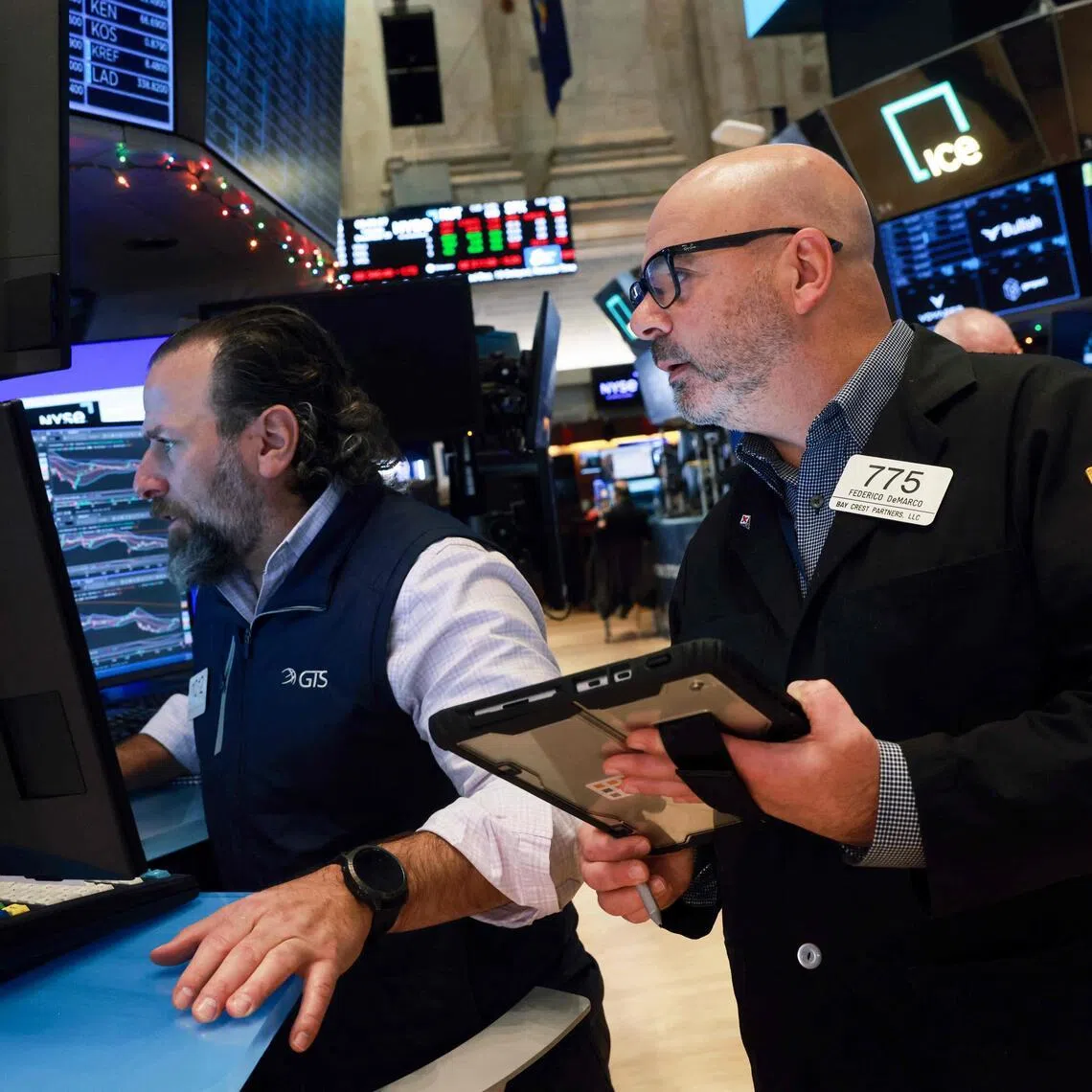 Traders working on the floor of the New York Stock Exchange on Dec 30, in New York City. 