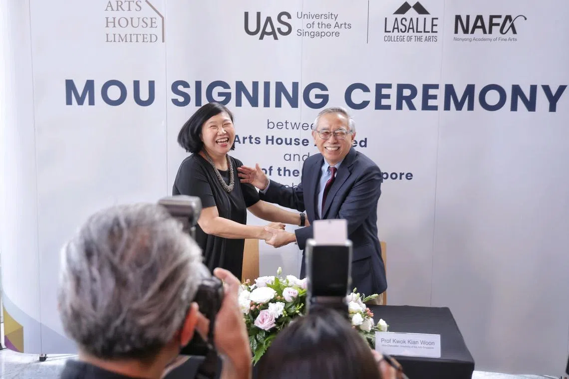 Ms Sharon Tan (left), executive director of Arts House Limited (AHL), and Prof Kwok Kian Woon, vice-chancellor of University of the Arts Singapore (UAS), shaking hands after signing a memorandum of understanding (MoU) at Victoria Theatre and Victoria Concert Hall on Oct 21, 2024. ST PHOTO KEVIN LIM etuas21