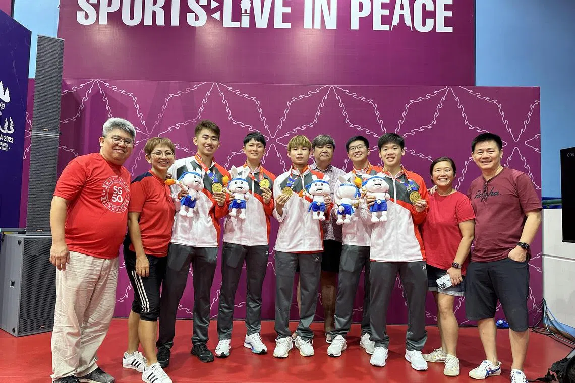 dlmother13 - (left to right) Barry and Christina Pang and their son Koen Pang, Clarence Chew, Beh Kun Ting, Dennis Poh and his son Ethan Poh, Izaac Quek and his parents Chew Soon and David Quek after Singapore won the SEA Games table tennis men's team gold on May 11.

Credit: David Lee
Section: Sports
Copyright: For SPH use only
