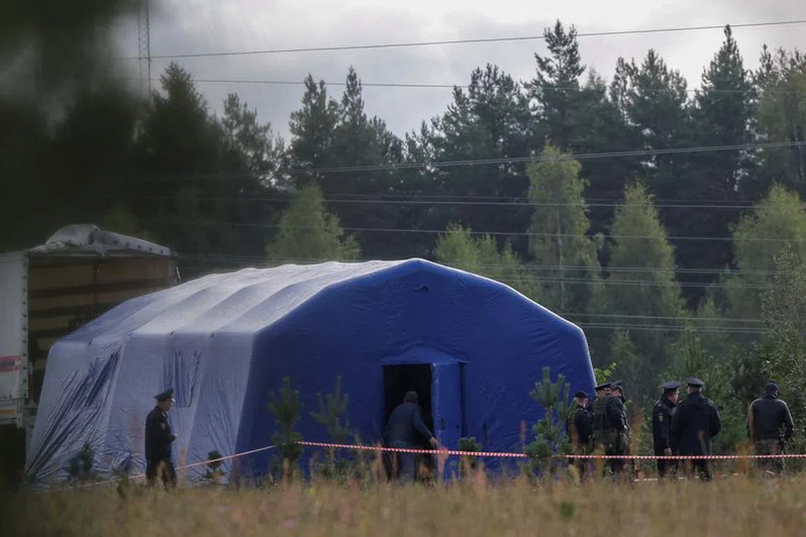 Police officers keep guard at a checkpoint near the site of the crash of a private jet linked to Wagner mercenary chief Yevgeny Prigozhin in the Tver region, Russia, August 24, 2023. REUTERS/Anton Vaganov/File Photo