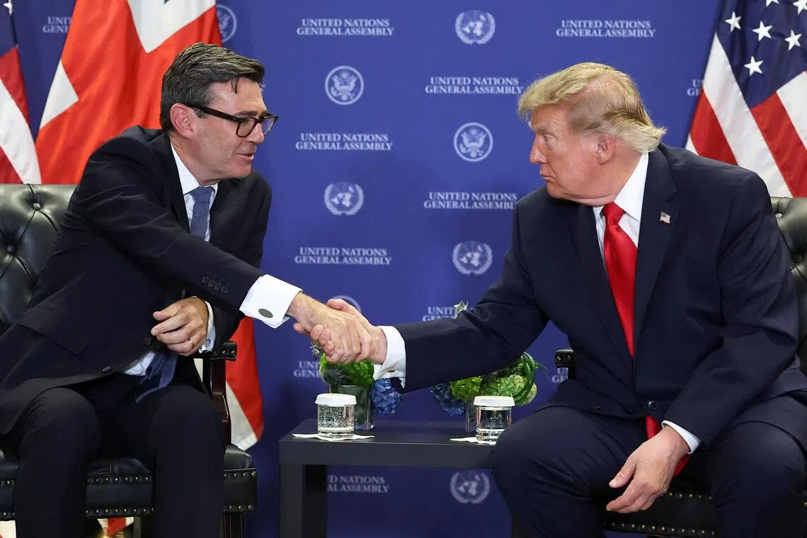 British Prime Minister Andy Burnham (left) shaking hands with US President Donald Trump on the sidelines of the United Nations General Assembly, in New York City, on Sept 22.