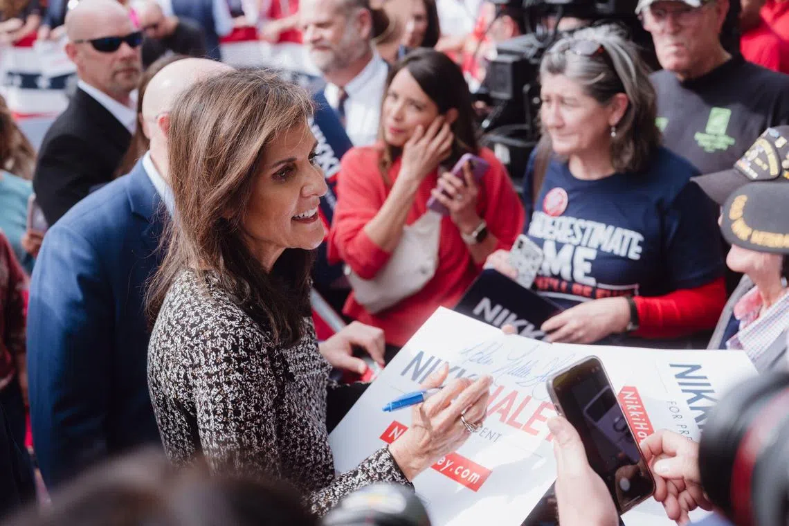 Nikki Haley (centre left) greets attendees at a campaign event in San Antonio, Texas