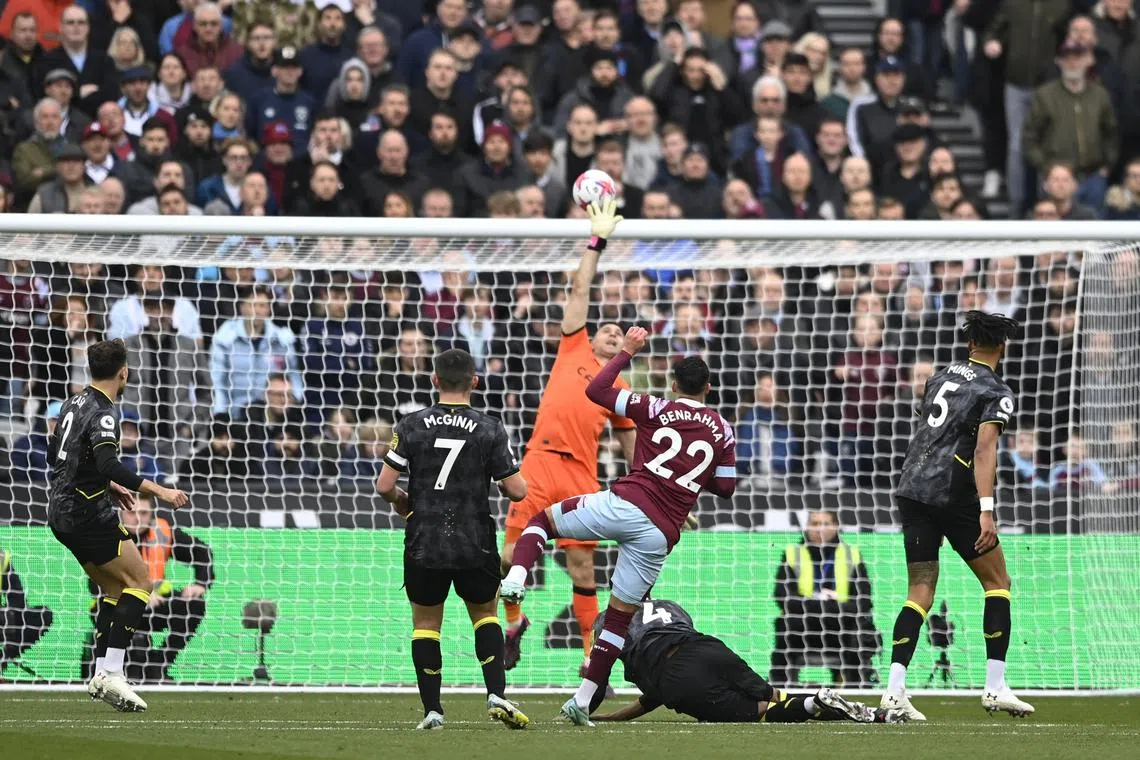 West Ham United's Said Benrahma in action with Aston Villa's Emiliano Martinez.