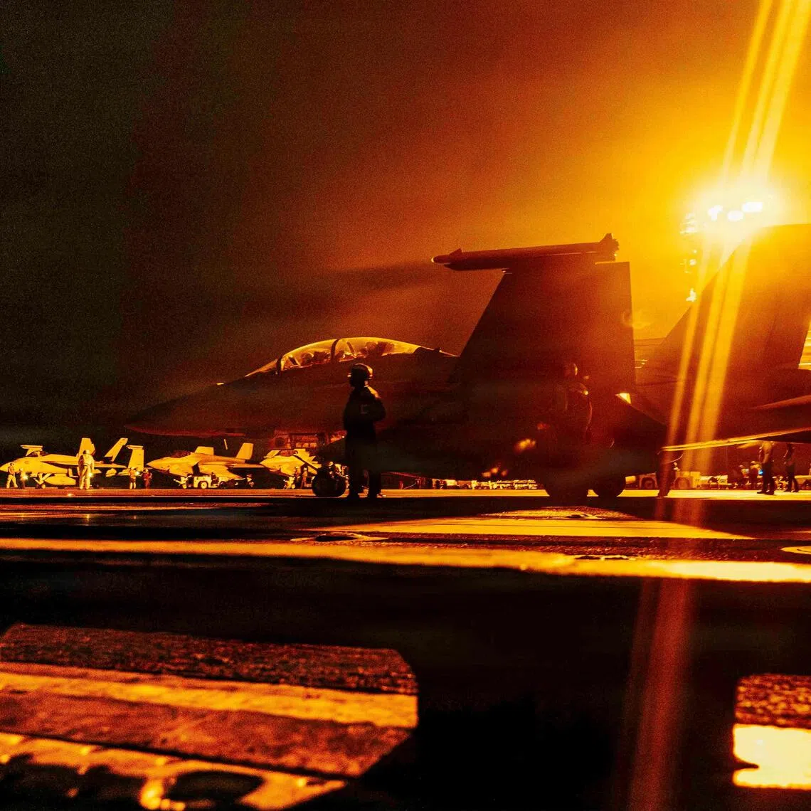 An F/A-18 Super Hornet readies for takeoff on the flight deck of the Nimitz-class aircraft carrier USS George Washington.