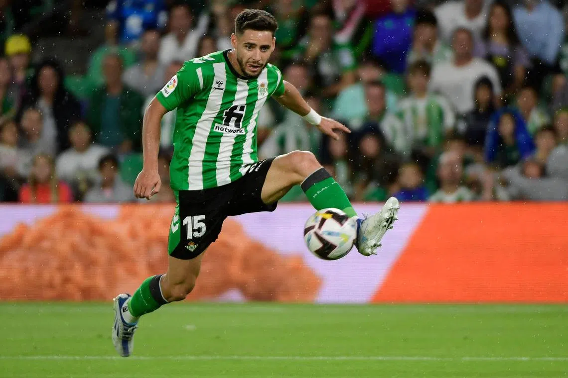 Real Betis' Spanish defender Alex Moreno controls the ball during the Spanish League football match between Real Betis and UD Almeria at the Benito Villamarin stadium in Seville on October 16, 2022. (Photo by CRISTINA QUICLER / AFP)