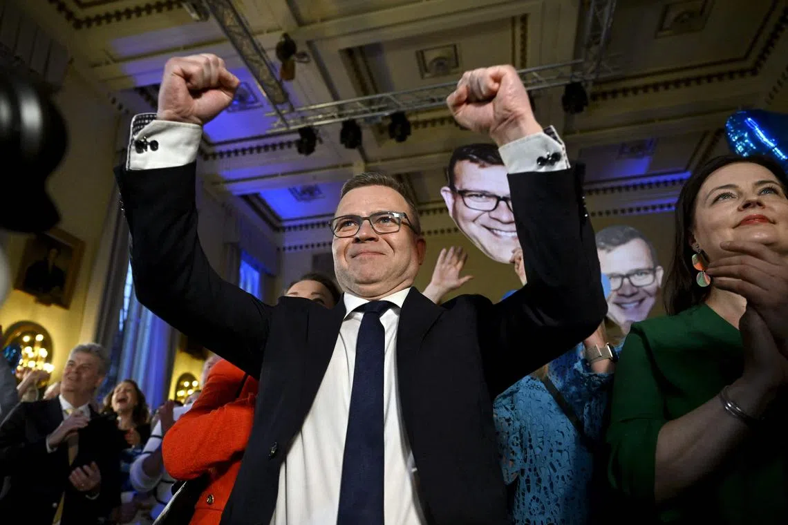 Chair of the liberal-conservative National Coalition Party Petteri Orpo reacts to the first exit poll results on April 2, 2023.