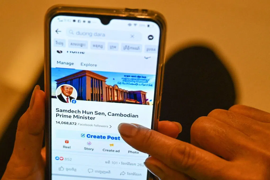 This photo illustration shows a post on Facebook by Cambodian government official Duong Dara, which includes an image of the official Facebook page of Cambodia's Prime Minister Hun Sen before he deleted his account, in Phnom Penh on June 30, 2023. Prime Minister Hun Sen said on June 30 he could block access to Facebook in Cambodia, after the company said it would remove a video in which he threatened to beat up political opponents. (Photo by TANG CHHIN Sothy / AFP)