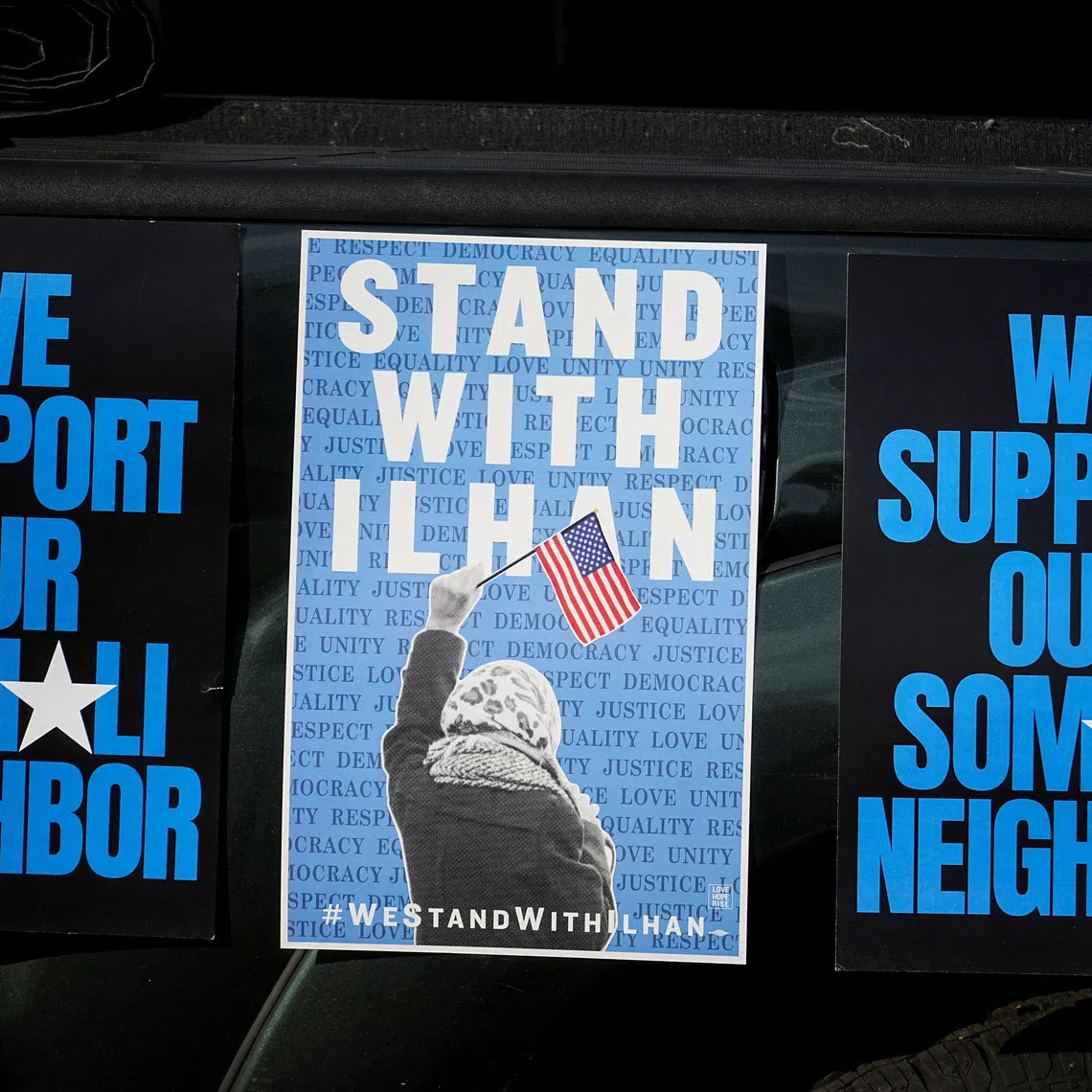 Messages of support for Democratic US Representative Ilhan Omar of Minnesota are displayed during a rally.