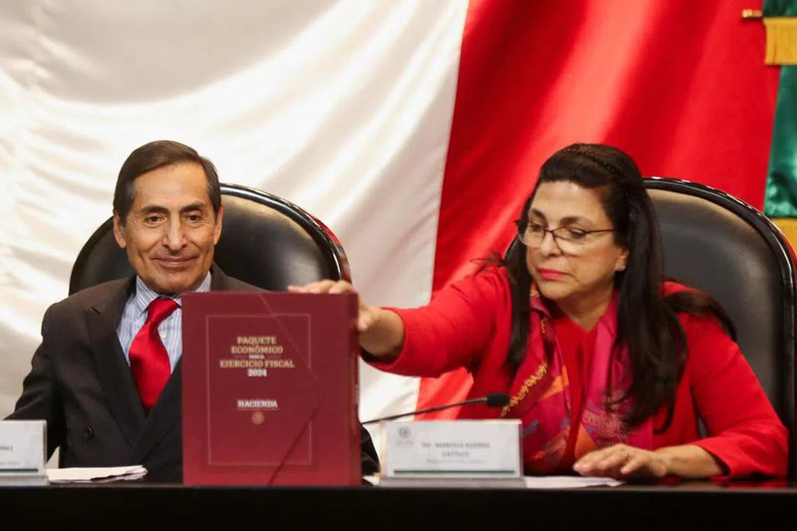 Mexico's Finance Ministry Rogelio Ramirez de la O and President of the Mexican Chamber of Deputies Directive Board Marcela Guerra present the 2024 national budget to the Congress, at the Congress building in Mexico City, Mexico September 8, 2023. REUTERS/Raquel Cunha