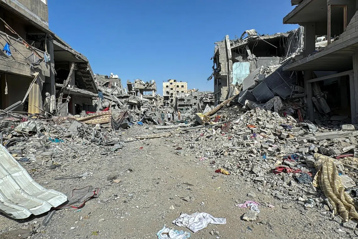 Palestinians view the damage after Israeli forces withdrew from the area around Kamal Adwan hospital, amid the ongoing Israel-Hamas conflict, in Jabalia, in the northern Gaza Strip October 26, 2024. REUTERS/Stringer/File Photo