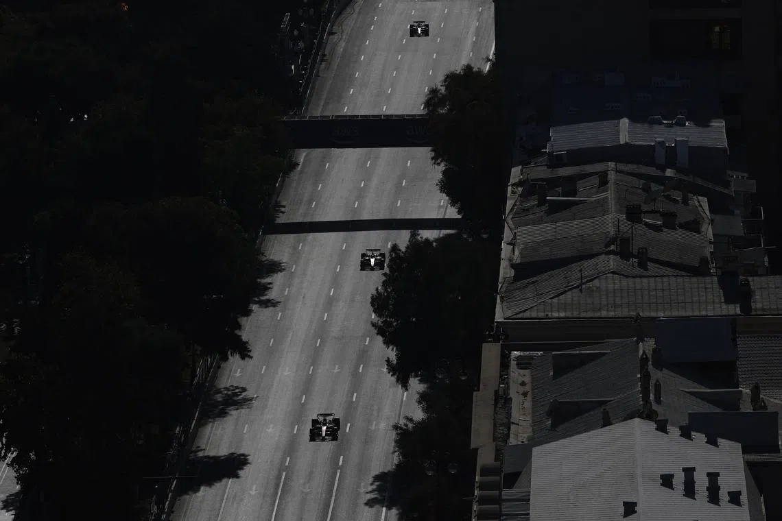 FILE PHOTO: Formula One F1 - Azerbaijan Grand Prix - Baku City Circuit, Baku, Azerbaijan - September 15, 2024 McLaren's Oscar Piastri leads Ferrari's Charles Leclerc during the race REUTERS/Maxim Shemetov/File Photo
