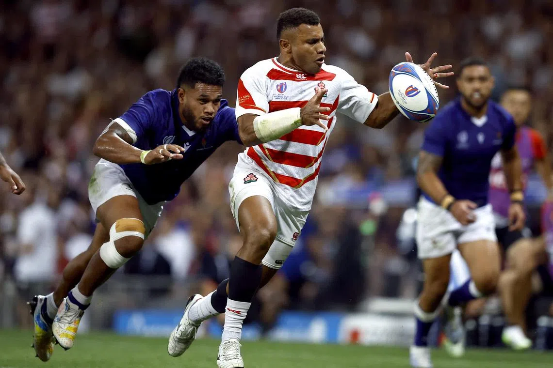 Samoa's Tumua Manu (left) in action with Japan's Jone Naikabula.