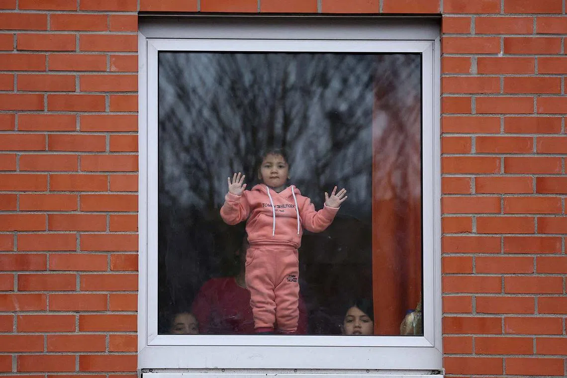 Children of refugees looking outside a window at the welcome centre for refugees in Giessen, Hesse, Germany, Feb 10, 2025. 