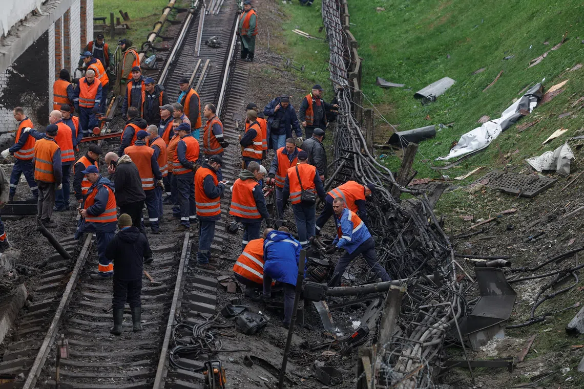 Employees repair railway tracks at a metro station which was hit by an overnight Russian missile strike, amid Russia's attack on Ukraine, in Kyiv, Ukraine October 19, 2026. REUTERS/Valentyn Ogirenko