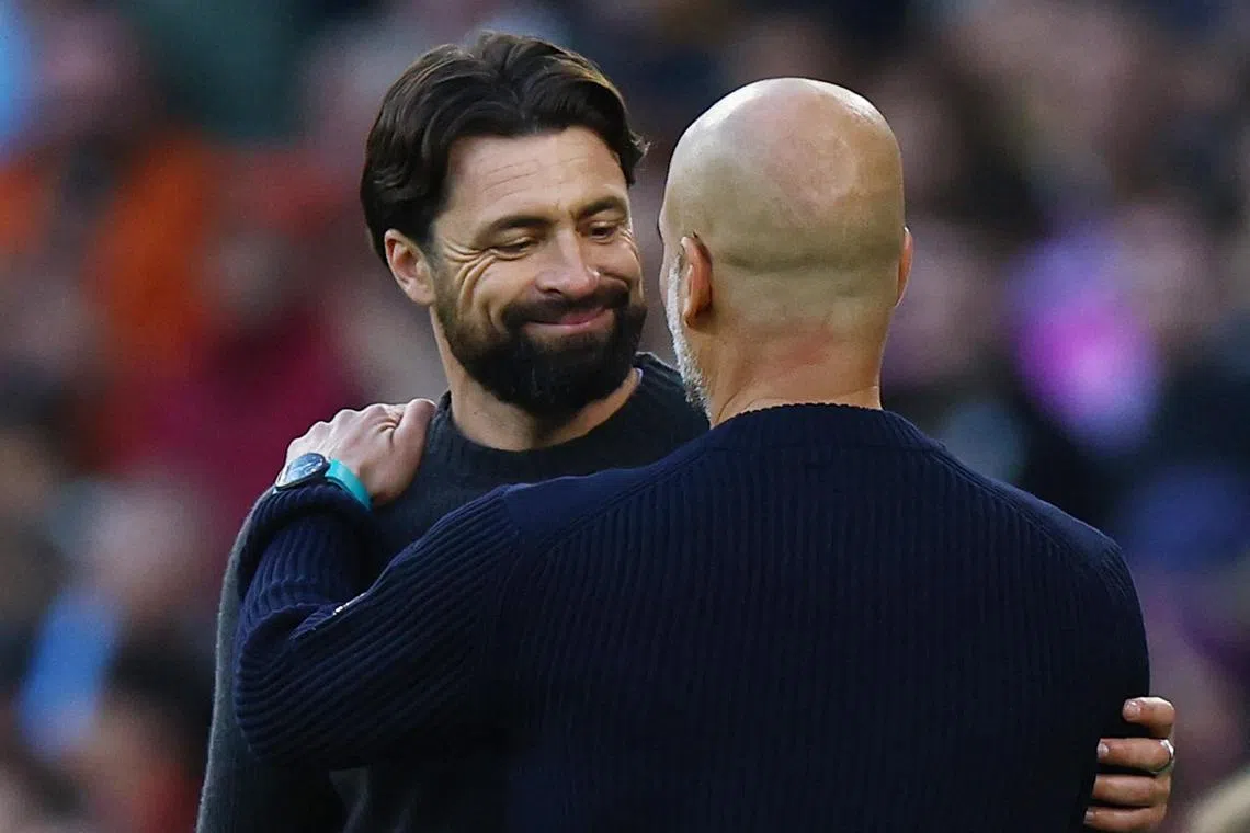 Manchester City manager Pep Guardiola (front) with Southampton manager Russell Martin after the match.