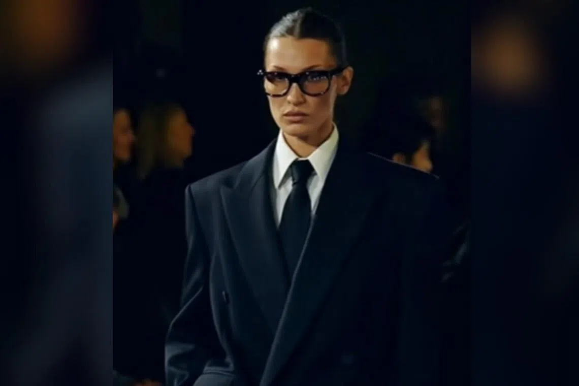 Model Bella Hadid walking for Saint Laurent at the Spring/Summer show in 2025. 