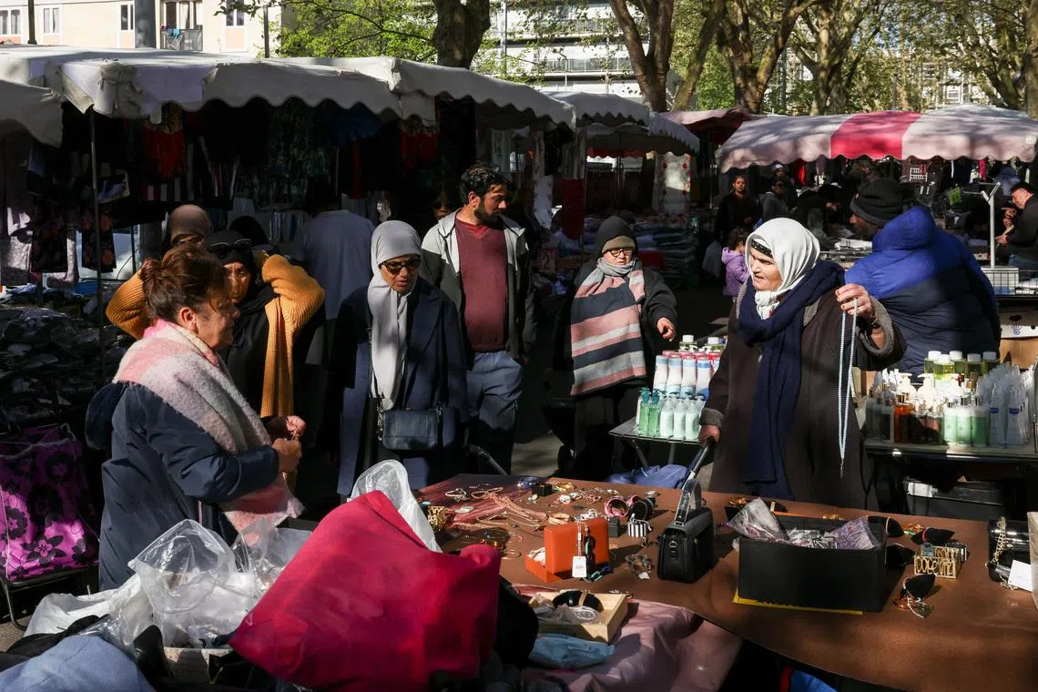 In France's poor, diverse suburbs, Melenchon's hard left charts a path to the presidency