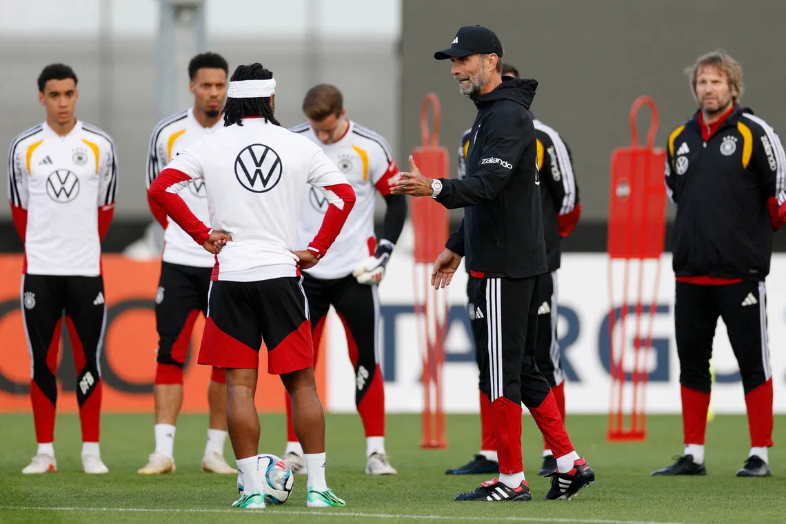 Germany coach Jurgen Klopp conducts a training session at Adidas campus in Germany, on Sept 22.